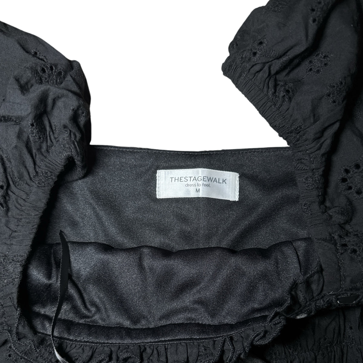 Gemstoresg black eyelet blouse with puff sleeves, square neckline, and floral embroidery detail.