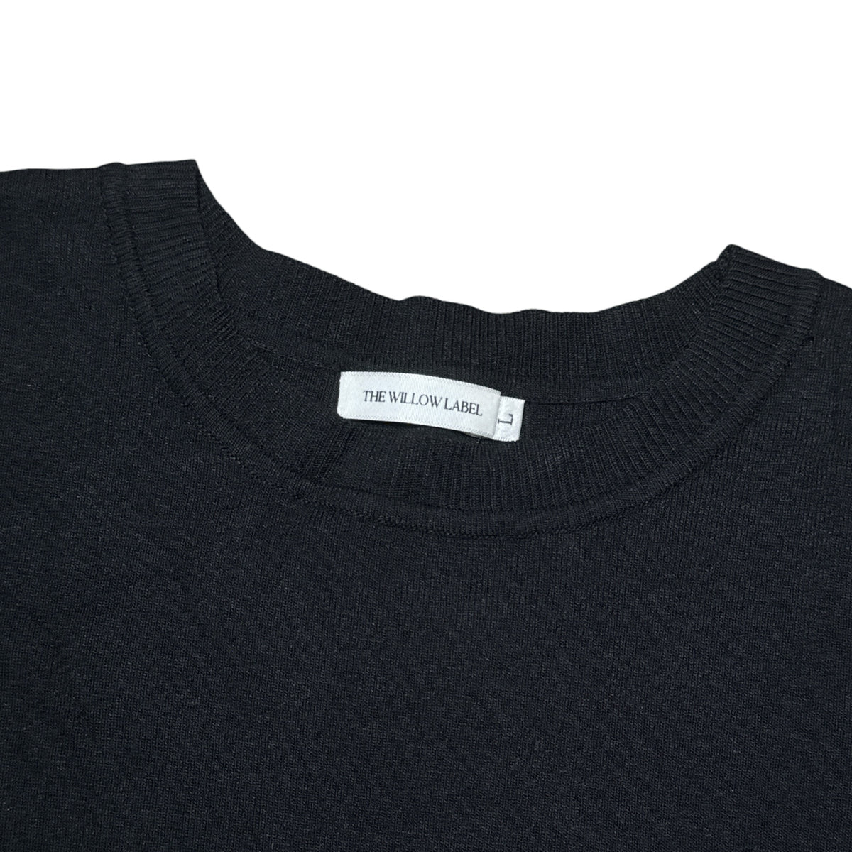 Gemstoresg black knit short sleeve top with a classic crew neckline and ribbed collar detail.